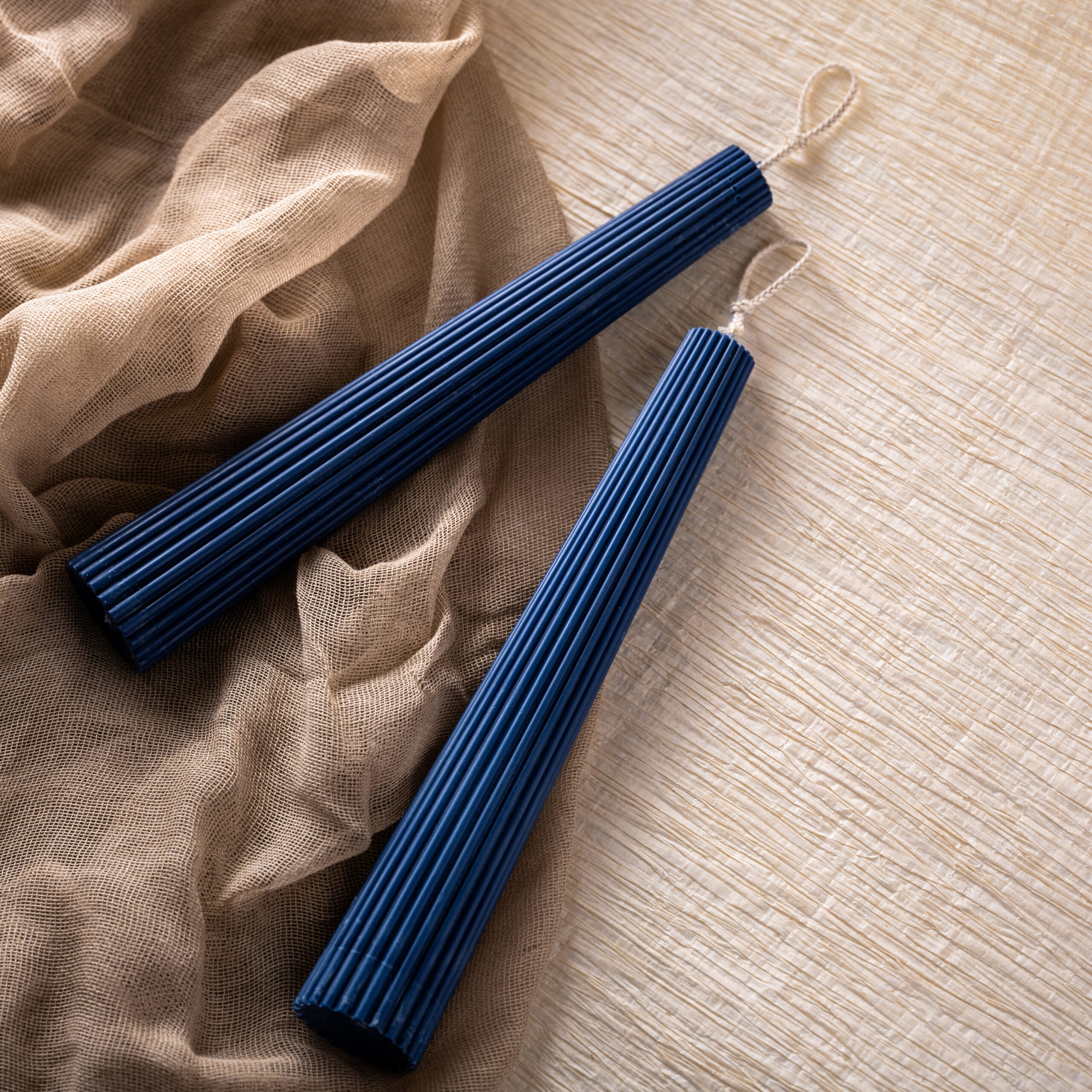 candles styled on natural fabric